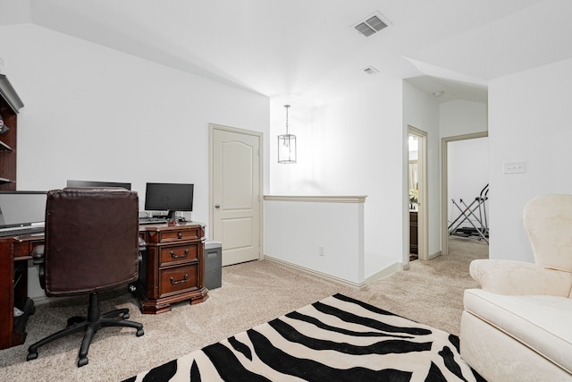 office featuring light colored carpet, visible vents, and baseboards