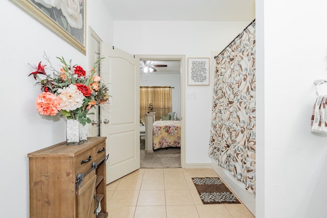 corridor featuring light tile patterned flooring