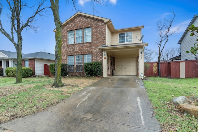 traditional-style home with an attached garage, fence, brick siding, and driveway