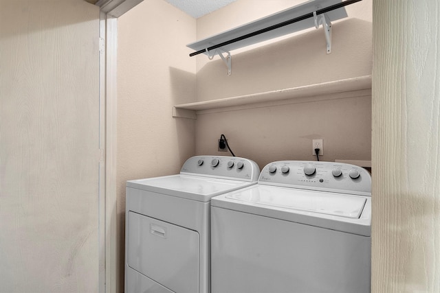 laundry room with independent washer and dryer and laundry area