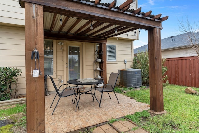 view of patio / terrace featuring central AC, a pergola, and fence