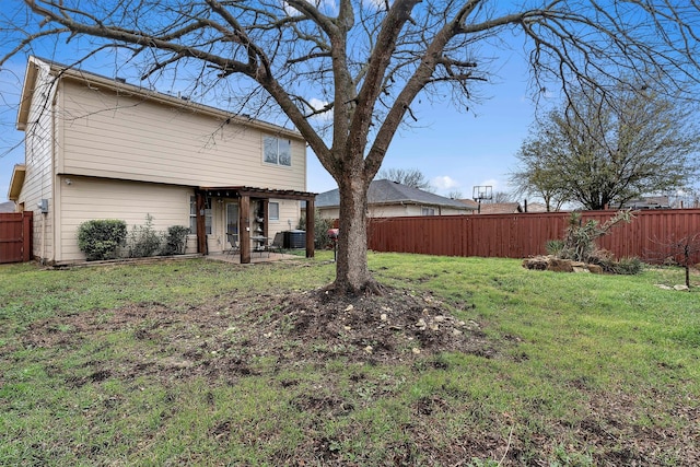 view of yard featuring cooling unit, a fenced backyard, and a patio area