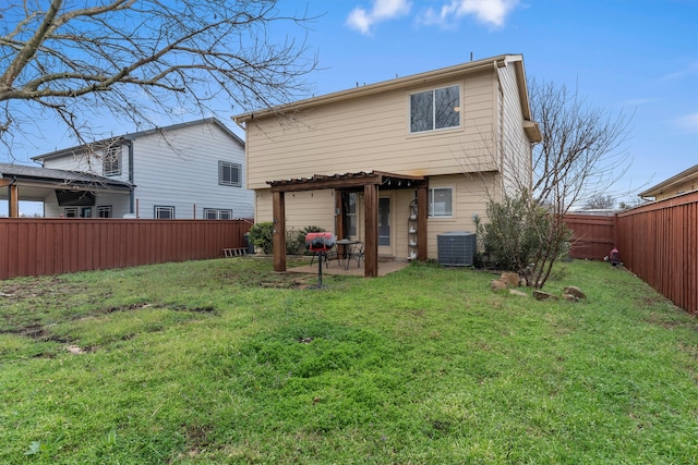 back of house with a patio, central AC, a lawn, and a fenced backyard