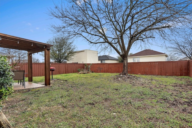 view of yard with a fenced backyard and a patio