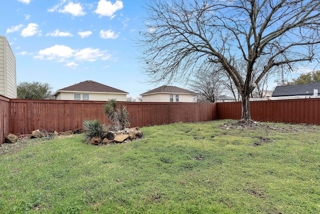 view of yard with a fenced backyard