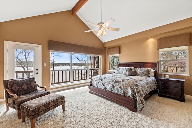 carpeted bedroom featuring beam ceiling, high vaulted ceiling, a ceiling fan, baseboards, and access to exterior