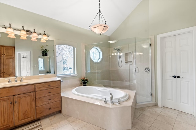 full bathroom featuring lofted ceiling, a stall shower, vanity, and a bath