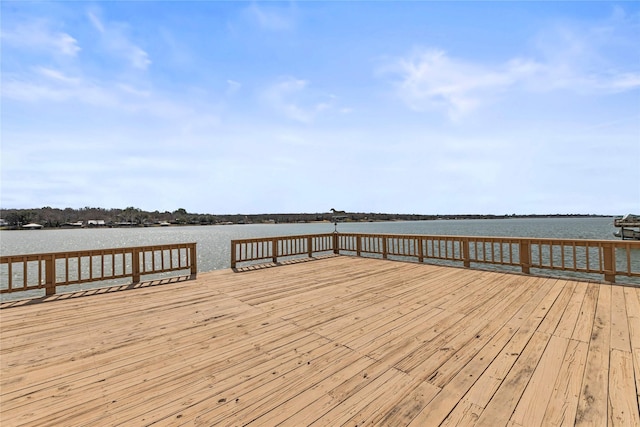 view of dock featuring a deck with water view