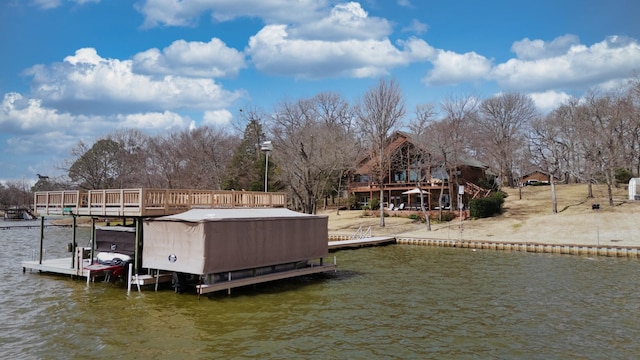 view of dock with a deck with water view