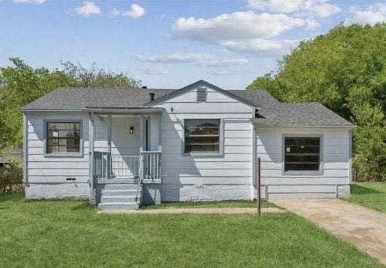 bungalow-style house featuring a front yard and crawl space