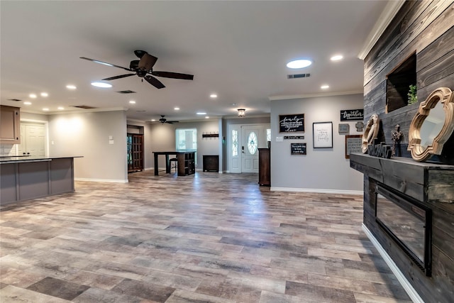 1809 Faulkner Dr, Rowlett, TX 75088 - living room with crown molding, recessed lighting, a ceiling fan, and a fireplace