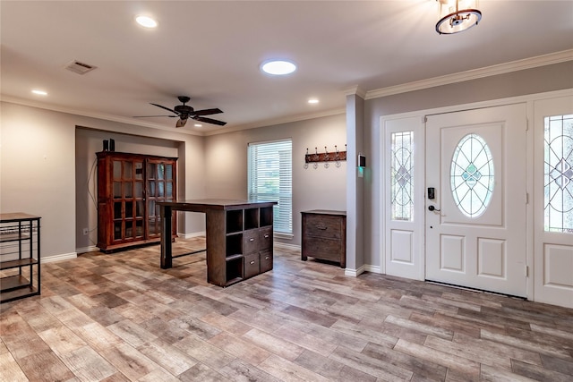 1809 Faulkner Dr, Rowlett, TX 75088 - foyer entrance featuring a ceiling fan, visible vents, baseboards, light wood-style floors, and ornamental molding