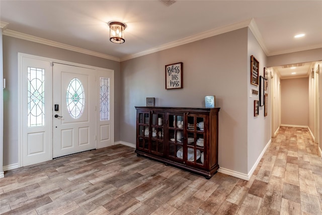 1809 Faulkner Dr, Rowlett, TX 75088 - foyer entrance featuring baseboards, ornamental molding, and light wood-style flooring