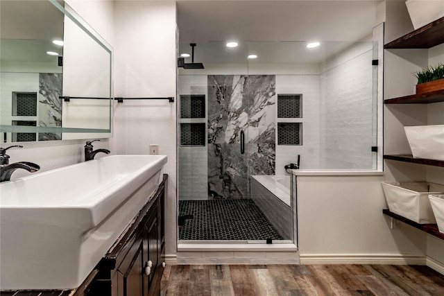 1809 Faulkner Dr, Rowlett, TX 75088 - bathroom with vanity, recessed lighting, baseboards, wood finished floors, and a stall shower