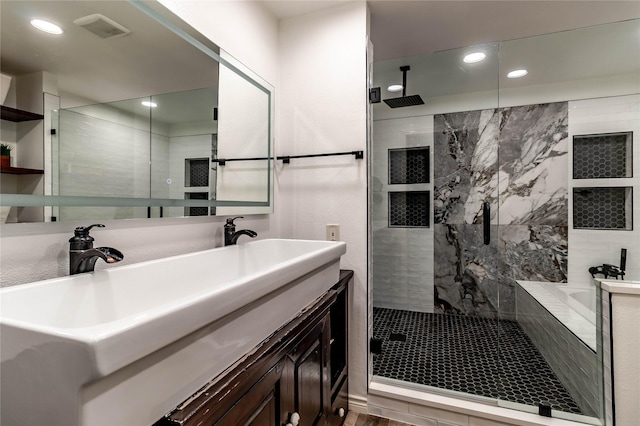 1809 Faulkner Dr, Rowlett, TX 75088 - full bath featuring a garden tub, double vanity, recessed lighting, and tiled shower