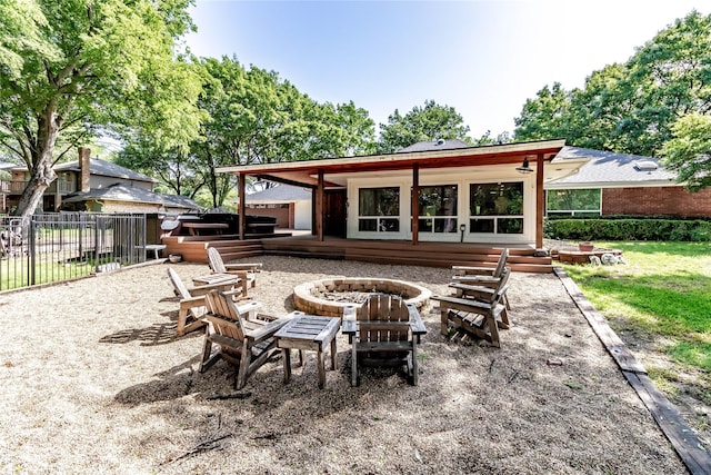 1809 Faulkner Dr, Rowlett, TX 75088 - back of property featuring a fire pit and fence