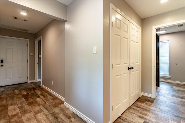 1809 Faulkner Dr, Rowlett, TX 75088 - corridor featuring baseboards, visible vents, and wood finished floors