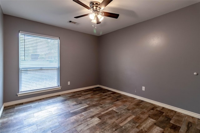 1809 Faulkner Dr, Rowlett, TX 75088 - empty room featuring baseboards, ceiling fan, dark wood-style floors, and a healthy amount of sunlight