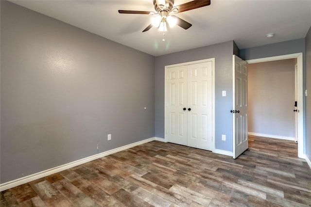 1809 Faulkner Dr, Rowlett, TX 75088 - unfurnished bedroom with baseboards, ceiling fan, wood finished floors, and a closet