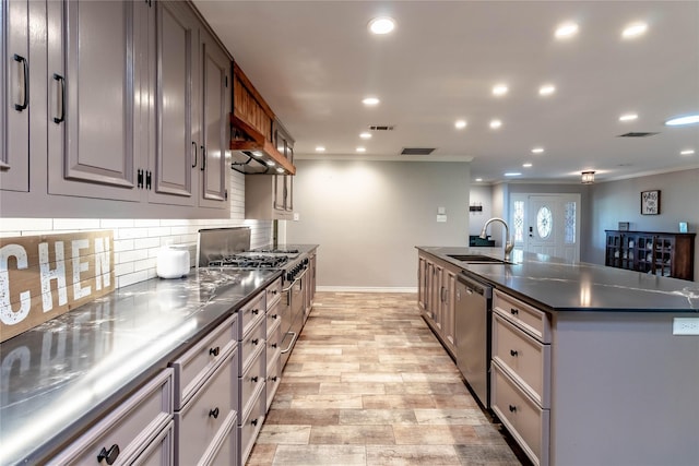 1809 Faulkner Dr, Rowlett, TX 75088 - kitchen featuring backsplash, dark countertops, a sink, ornamental molding, and stainless steel appliances