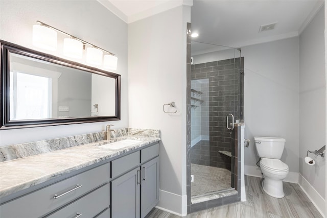 bathroom with visible vents, baseboards, toilet, a stall shower, and vanity