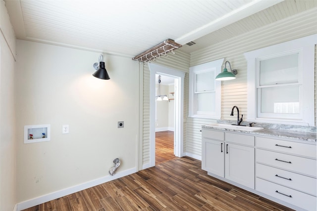 washroom with dark wood-style floors, laundry area, electric dryer hookup, washer hookup, and a sink