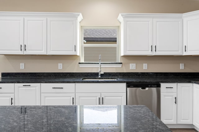 kitchen with white cabinets, dishwasher, dark stone counters, and a sink