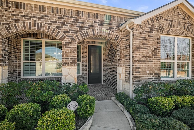 entrance to property with brick siding