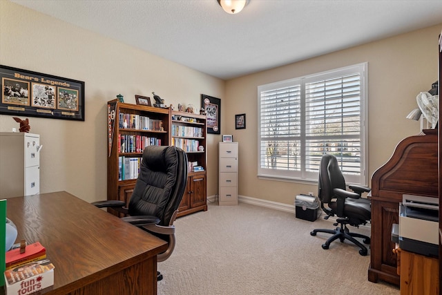 office area with baseboards and carpet floors