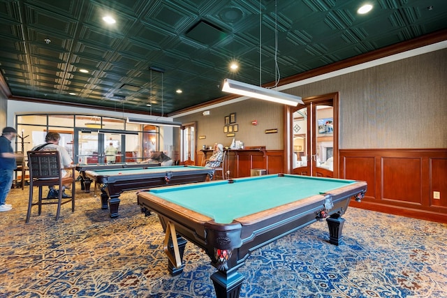 recreation room featuring billiards, an ornate ceiling, carpet floors, wainscoting, and crown molding