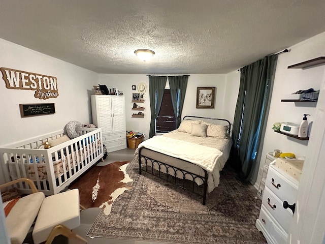 bedroom featuring a textured ceiling