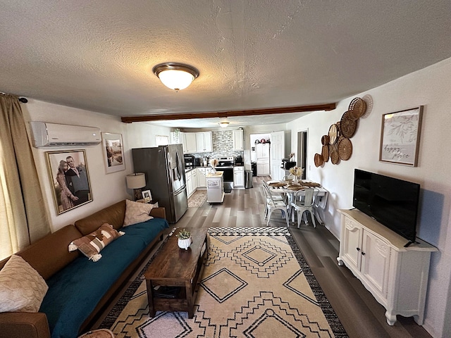 living room with a textured ceiling, dark wood-style floors, and a wall mounted AC