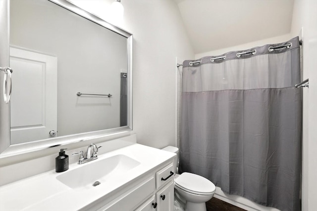 full bathroom with lofted ceiling, toilet, shower / tub combo with curtain, and vanity