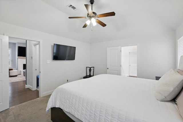 bedroom with baseboards, visible vents, carpet floors, and ceiling fan