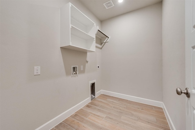 washroom with electric dryer hookup, visible vents, hookup for a gas dryer, light wood-style floors, and laundry area