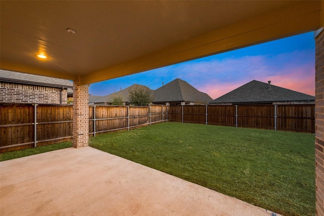 view of yard with a fenced backyard and a patio