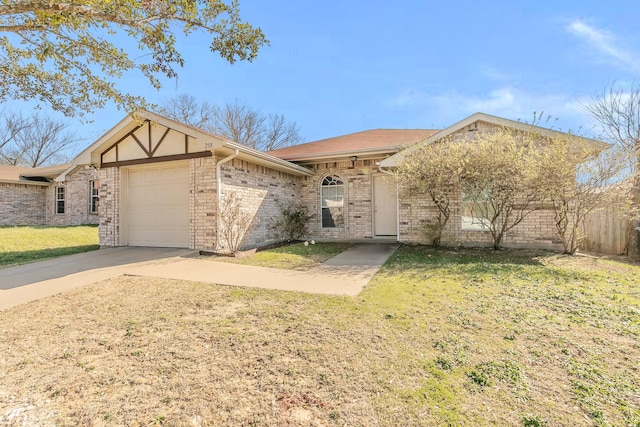 view of front facade featuring brick siding, concrete driveway, a front yard, and a garage