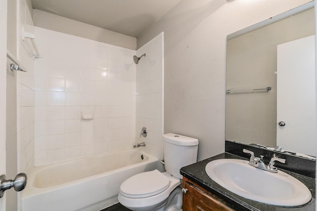 bathroom with shower / bathtub combination, toilet, and vanity