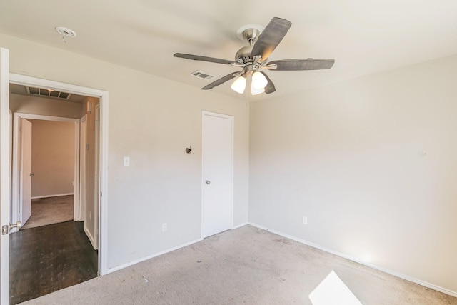 unfurnished bedroom with visible vents, a ceiling fan, and baseboards