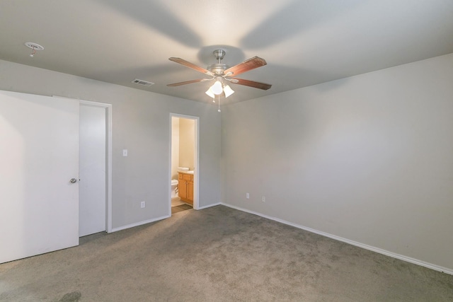 unfurnished bedroom with a ceiling fan, baseboards, visible vents, carpet flooring, and connected bathroom