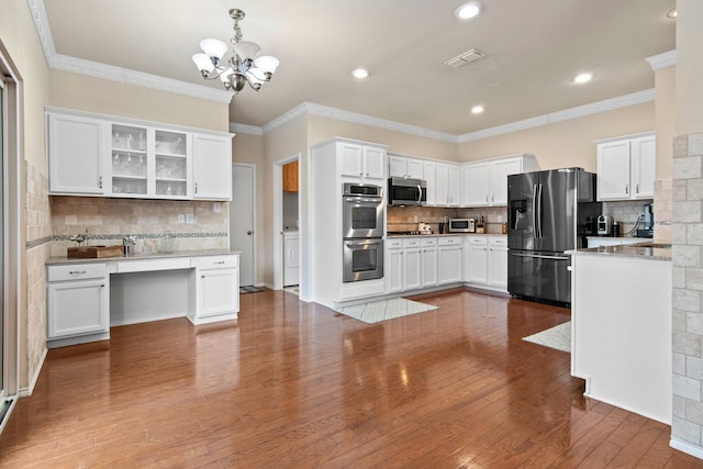 kitchen featuring hardwood / wood-style flooring, white cabinets, glass insert cabinets, appliances with stainless steel finishes, and crown molding