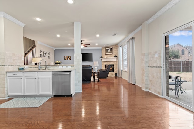 kitchen with ceiling fan, dark wood-type flooring, white cabinets, dishwasher, and crown molding