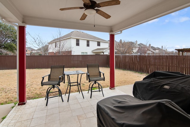 view of patio / terrace with a ceiling fan and a fenced backyard