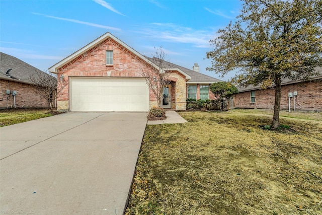 view of front of house featuring driveway, a front yard, an attached garage, brick siding, and a chimney