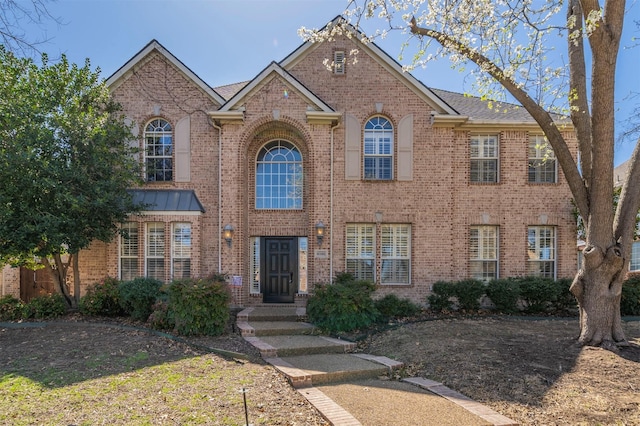 view of front of home with brick siding