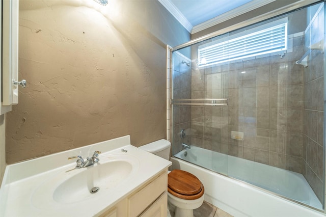 bathroom with crown molding, bath / shower combo with glass door, toilet, a textured wall, and vanity