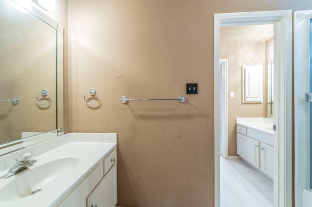 full bath featuring two vanities and a sink