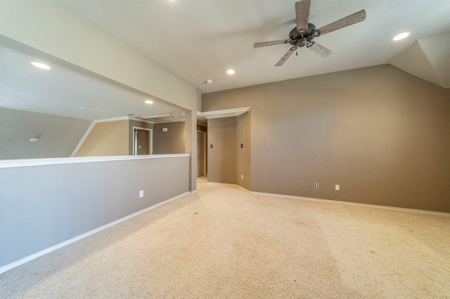 interior space featuring ceiling fan, baseboards, vaulted ceiling, light carpet, and recessed lighting