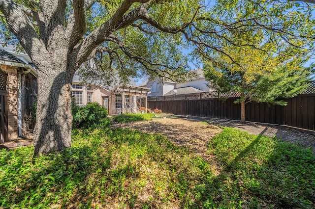 view of yard featuring a fenced backyard and a pergola