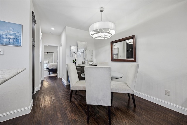 7917 Parkwood Blvd, Plano, TX 75024 - dining area with dark wood-style floors, baseboards, and a chandelier